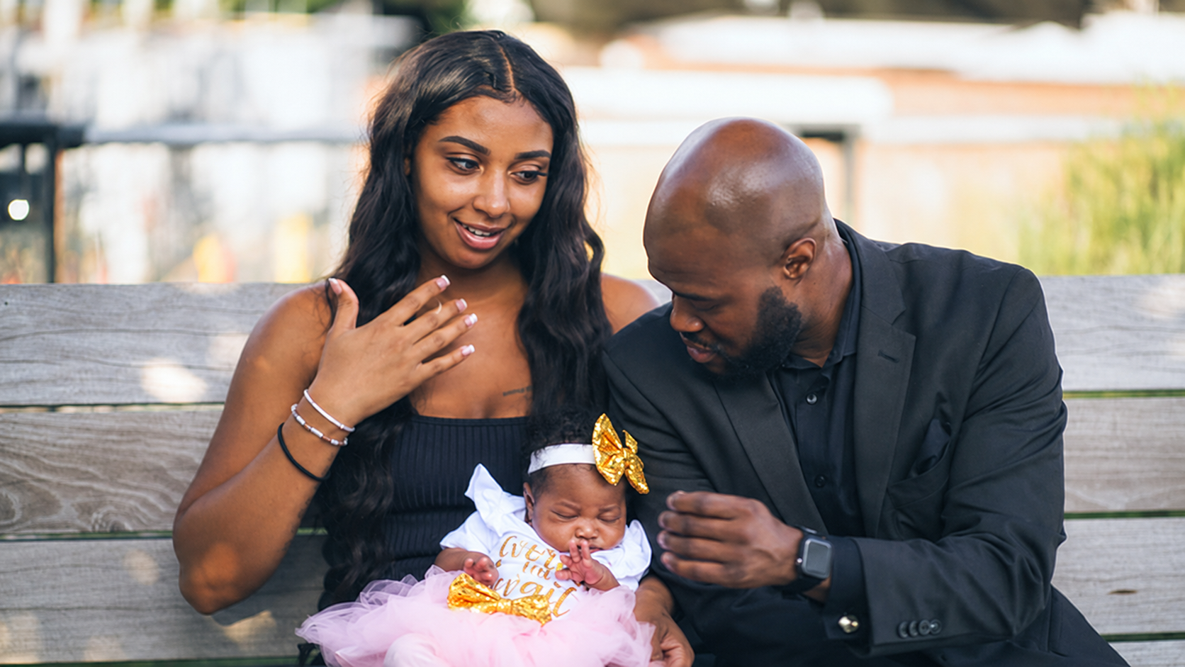 Parents sharing a candid moment with their daughter